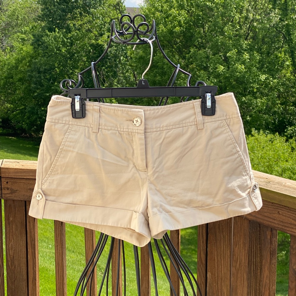 Express design studio tan shorts with silver buttons. Size 4.